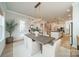 Open concept dining area with modern light fixture, hardwood floors, and easy access to the kitchen at 11036 Shreveport Dr, Huntersville, NC 28078