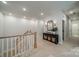 Upstairs hallway with elegant decor and natural light at 11036 Shreveport Dr, Huntersville, NC 28078
