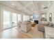 Inviting living room with fireplace, coffered ceiling, large windows, and sliding doors to outdoor patio at 11036 Shreveport Dr, Huntersville, NC 28078