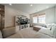 Comfortable living room with built ins, plush seating, and plenty of natural light at 11036 Shreveport Dr, Huntersville, NC 28078