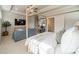 Bright main bedroom with a four poster bed, sitting area, and ensuite bathroom at 11036 Shreveport Dr, Huntersville, NC 28078