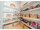 Organized walk-in pantry with ample shelving and storage baskets, perfect for storing all your essentials at 11036 Shreveport Dr, Huntersville, NC 28078