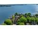 Stunning aerial view of a waterfront estate, showcasing lush landscaping and private dock on a serene lake at 114 Ventana Ct, Mooresville, NC 28117