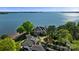 Stunning aerial view of a lakefront home with lush landscaping and private dock on a serene body of water at 114 Ventana Ct, Mooresville, NC 28117
