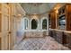 This luxurious bathroom offers a walk-in shower, soaking tub, and decorative arched windows at 114 Ventana Ct, Mooresville, NC 28117
