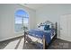 This bedroom features a large arched window with peaceful water views and an iron bed frame at 114 Ventana Ct, Mooresville, NC 28117
