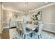 Dining room with a modern chandelier, elegant chairs, and neutral colors at 114 Ventana Ct, Mooresville, NC 28117