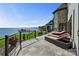 A spacious outdoor patio is perfect for entertaining with stunning lake views at 114 Ventana Ct, Mooresville, NC 28117