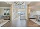 Grand foyer with hardwood floors, decorative columns, staircase and water views at 114 Ventana Ct, Mooresville, NC 28117