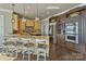 Kitchen with stainless steel appliances, granite countertops, large island with seating, and custom cabinetry at 114 Ventana Ct, Mooresville, NC 28117