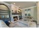 Comfortable living room featuring a fireplace, built-in shelving, and stylish decor at 114 Ventana Ct, Mooresville, NC 28117