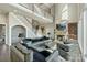 A spacious living room with high ceilings, fireplace, and staircase in view at 114 Ventana Ct, Mooresville, NC 28117