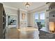 A bright office space with hardwood floors, built-in shelves, and a lake view at 114 Ventana Ct, Mooresville, NC 28117
