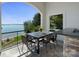 Outdoor bar with table and lake view provides the perfect spot for relaxation at 114 Ventana Ct, Mooresville, NC 28117