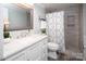 Neutral bathroom features a vanity, toilet and a shower with tile at 11901 Rock Canyon Dr, Charlotte, NC 28226