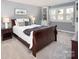 Comfortable bedroom with queen bed, soft carpet, and neutral décor at 11901 Rock Canyon Dr, Charlotte, NC 28226