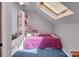 Cozy bedroom features a built-in bed, shelving, and a skylight, creating a bright and comfortable space at 11901 Rock Canyon Dr, Charlotte, NC 28226