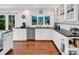 Bright kitchen with stainless steel appliances, granite countertops, and a view of backyard at 11901 Rock Canyon Dr, Charlotte, NC 28226