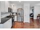 Modern kitchen with stainless steel appliances and granite countertops, seamlessly connecting to living area at 11901 Rock Canyon Dr, Charlotte, NC 28226
