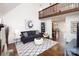 Open concept living room featuring a balcony and seamless flow into the dining area at 11901 Rock Canyon Dr, Charlotte, NC 28226