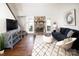 Bright living room with stone fireplace, vaulted ceiling, and modern decor at 11901 Rock Canyon Dr, Charlotte, NC 28226