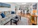 Living room, kitchen and access to deck, hardwood floors and light walls at 11901 Rock Canyon Dr, Charlotte, NC 28226