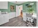 Office area with custom desk and a large window providing natural light at 11901 Rock Canyon Dr, Charlotte, NC 28226