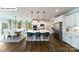 Spacious kitchen featuring a center island with seating, stainless steel appliances, and hardwood floors at 128 Fordingbridge Ln, Mooresville, NC 28115
