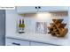 Bright pantry showcasing modern cabinets, sleek countertops, backsplash, and under-cabinet lighting at 128 Fordingbridge Ln, Mooresville, NC 28115