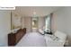 Cozy room featuring two white armchairs, a brown cabinet, and natural light at 128 Fordingbridge Ln, Mooresville, NC 28115