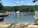 Scenic boat ramp and lake access point surrounded by a lush landscape and docks at 134 Putt Putt Ln, New London, NC 28127