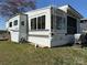 Well maintained mobile home featuring a ladder for easy roof access and lots of windows for natural light at 134 Putt Putt Ln, New London, NC 28127