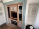 Living room with built in fireplace, cabinets, drawers and TV entertainment center at 134 Putt Putt Ln, New London, NC 28127