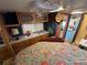 Comfortable main bedroom with overhead storage, decor, and an ensuite sink at 134 Putt Putt Ln, New London, NC 28127