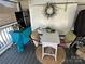 Cozy screened porch featuring a small table setting, mini fridge and rustic decor for outdoor dining and relaxation at 134 Putt Putt Ln, New London, NC 28127