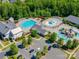 Aerial view of the community pool and recreation area surrounded by lush trees at 1504 Ridge Haven Rd, Waxhaw, NC 28173