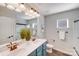 This bathroom features a large mirror, a double sink vanity, and a shower with glass doors at 1504 Ridge Haven Rd, Waxhaw, NC 28173