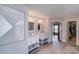 Bright bathroom with double vanities, a walk-in closet, and tile floors at 1504 Ridge Haven Rd, Waxhaw, NC 28173