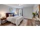 Comfortable bedroom featuring hardwood floors and a decorative art piece at 1504 Ridge Haven Rd, Waxhaw, NC 28173