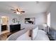 A cozy bedroom with an ensuite bathroom featuring a black dresser, artwork, and modern furnishings at 1504 Ridge Haven Rd, Waxhaw, NC 28173