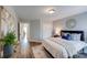 An open-concept bedroom with wood floors, closet space, and a nearby bathroom at 1504 Ridge Haven Rd, Waxhaw, NC 28173