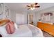 A bright bedroom with a ceiling fan, dresser, and closet at 1504 Ridge Haven Rd, Waxhaw, NC 28173