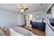 A bedroom with hard wood floors, a ceiling fan, ensuite bathroom, and a closet at 1504 Ridge Haven Rd, Waxhaw, NC 28173