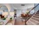 Inviting dining room featuring hardwood floors, elegant decor, and a staircase at 1504 Ridge Haven Rd, Waxhaw, NC 28173