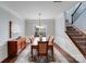 Bright dining room with wood floors, a large window, and classic wood furniture at 1504 Ridge Haven Rd, Waxhaw, NC 28173