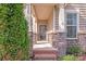 Charming covered porch with stone accents, offering a welcoming entrance to the home at 1504 Ridge Haven Rd, Waxhaw, NC 28173