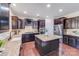 Kitchen with dark cabinets, stainless appliances, island and granite countertops at 1504 Ridge Haven Rd, Waxhaw, NC 28173