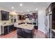 Well-appointed kitchen with an island, granite countertops, and stainless steel appliances at 1504 Ridge Haven Rd, Waxhaw, NC 28173