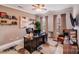 Office with a large desk, shelves, and comfortable seating perfect for working from home at 1504 Ridge Haven Rd, Waxhaw, NC 28173