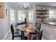 Charming breakfast nook with a round table, comfortable seating, and bright natural light, perfect for casual dining at 1537 Wheaton Nw Way, Concord, NC 28027